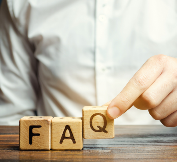 businessman-puts-wooden-blocks-with-word-faq